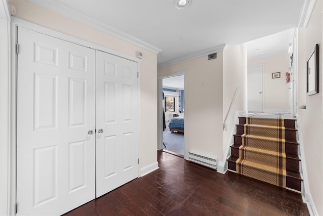 interior space featuring dark wood-type flooring, ornamental molding, and baseboard heating