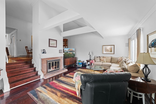 living room featuring lofted ceiling, a baseboard heating unit, dark hardwood / wood-style floors, a fireplace, and ornamental molding