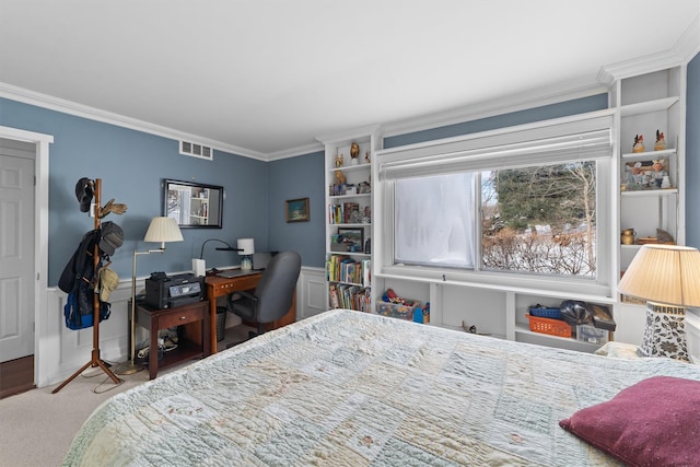 bedroom featuring crown molding and carpet floors