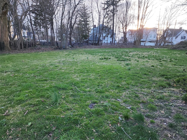 view of yard at dusk