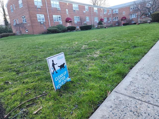 view of community featuring a yard