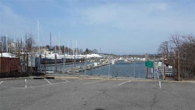 view of car parking with a water view