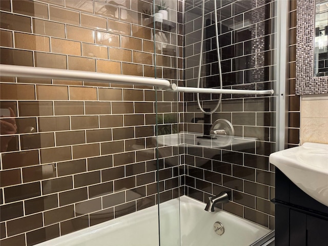 bathroom featuring vanity and enclosed tub / shower combo