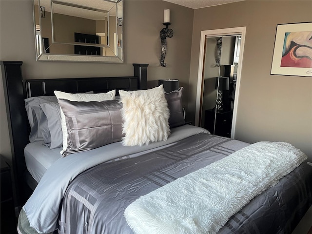 bedroom with a closet and a textured ceiling