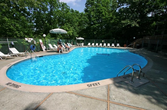 view of pool featuring a patio area