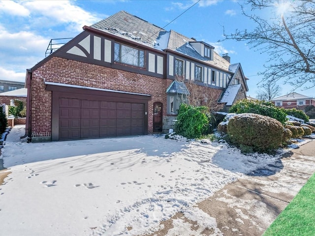 tudor home featuring a garage