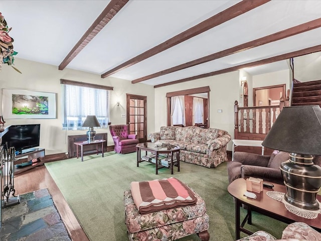 living room with hardwood / wood-style floors and beam ceiling