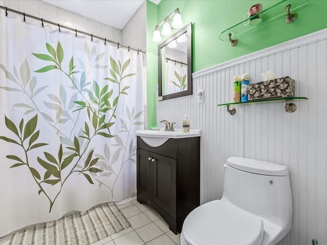 bathroom featuring a shower with shower curtain, vanity, toilet, and tile patterned flooring