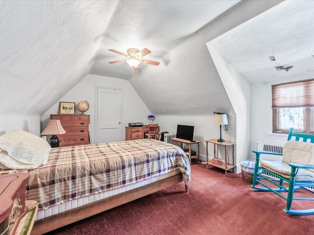 carpeted bedroom with ceiling fan, lofted ceiling, and a textured ceiling