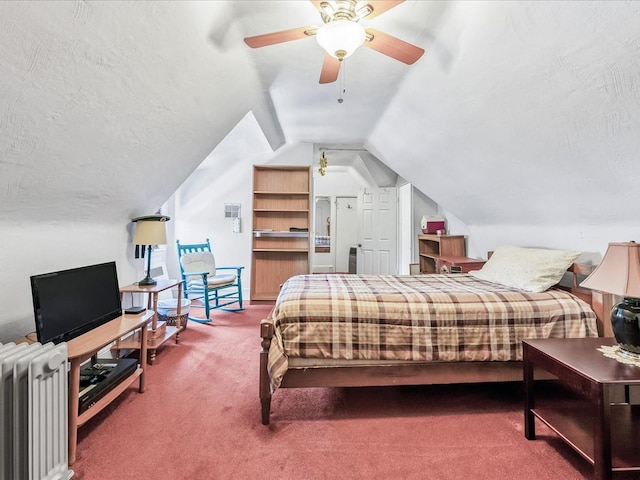 bedroom featuring radiator, ceiling fan, carpet floors, a textured ceiling, and vaulted ceiling