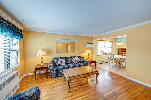 living room featuring radiator heating unit, a baseboard heating unit, a wall mounted air conditioner, ornamental molding, and light hardwood / wood-style floors