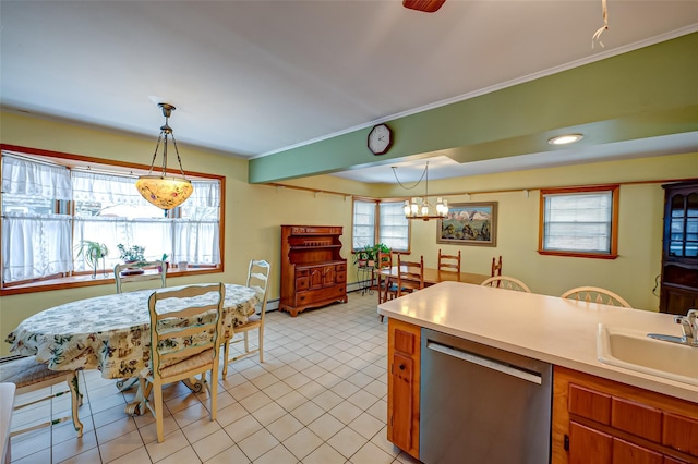 kitchen featuring decorative light fixtures, sink, a wealth of natural light, and stainless steel dishwasher