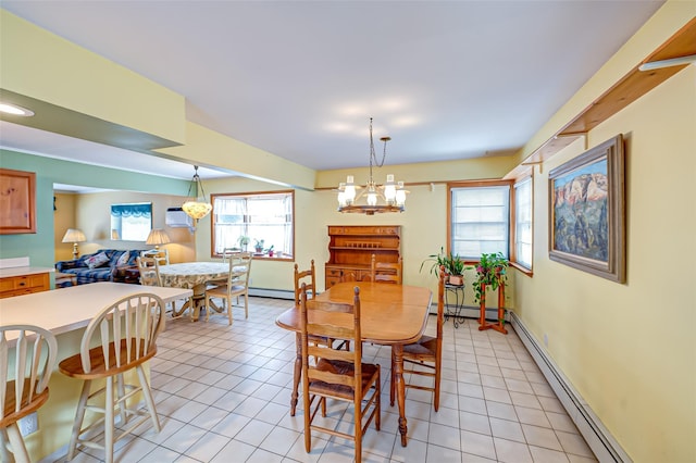 tiled dining room with a baseboard radiator