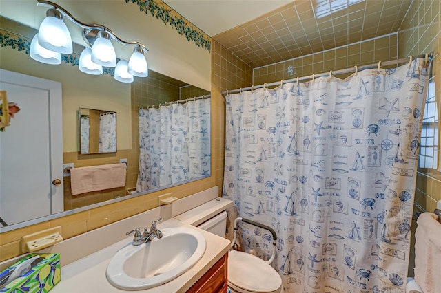 bathroom with vanity, toilet, and a shower with shower curtain