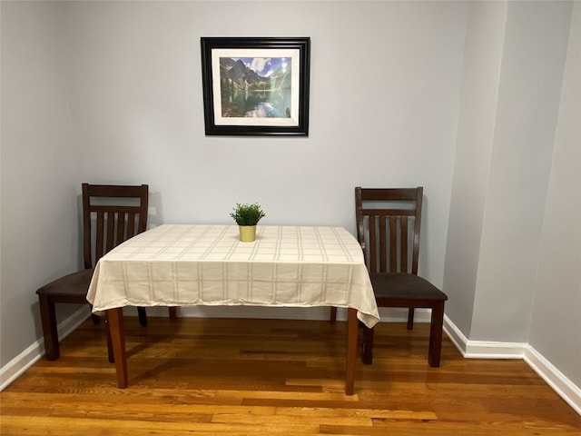 dining space featuring hardwood / wood-style flooring