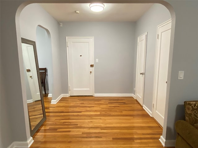 hallway with light wood-type flooring