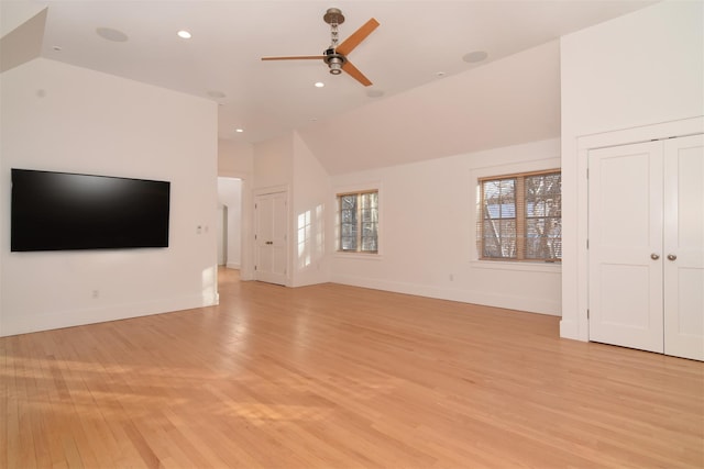 unfurnished living room with ceiling fan, lofted ceiling, and light hardwood / wood-style flooring