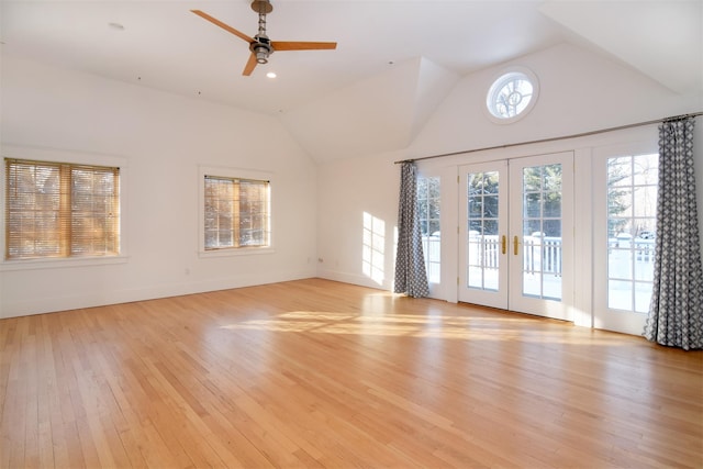 spare room featuring french doors, ceiling fan, vaulted ceiling, and light hardwood / wood-style flooring