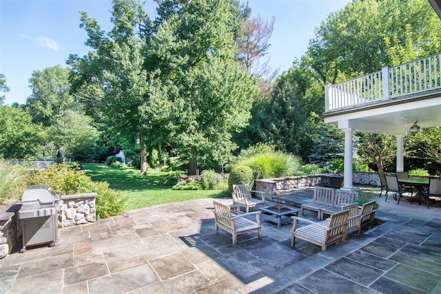 view of patio featuring an outdoor living space and a balcony