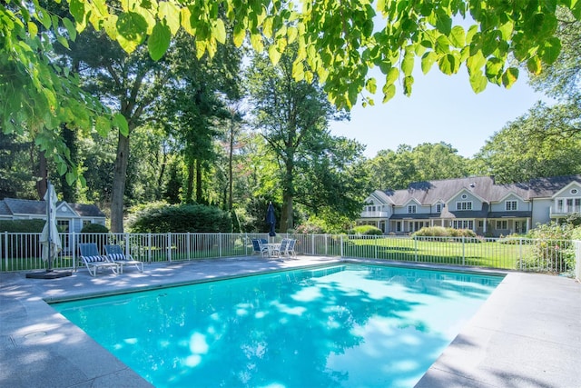 view of swimming pool with a patio area