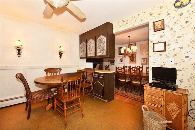 dining room featuring ceiling fan with notable chandelier and tile patterned flooring