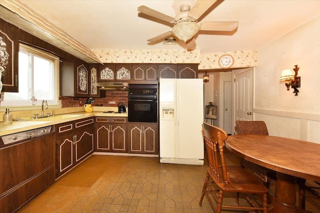 kitchen featuring ceiling fan, sink, white appliances, and dark brown cabinets