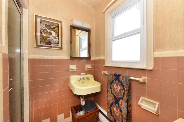 bathroom featuring tile walls