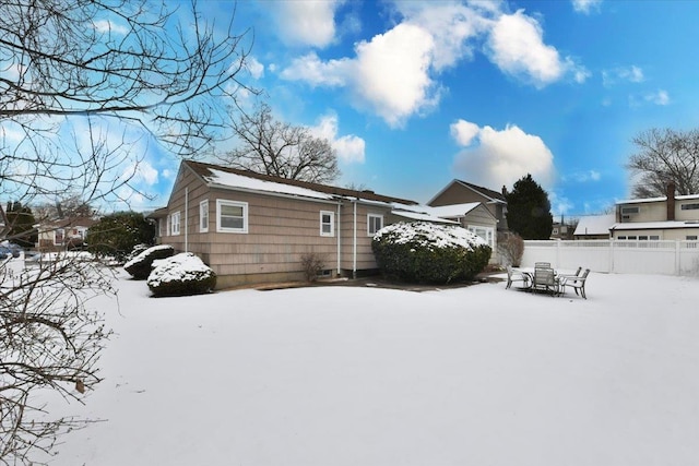 view of snow covered house