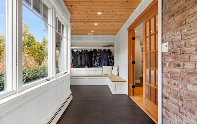 hallway featuring brick wall, a baseboard radiator, and wooden ceiling