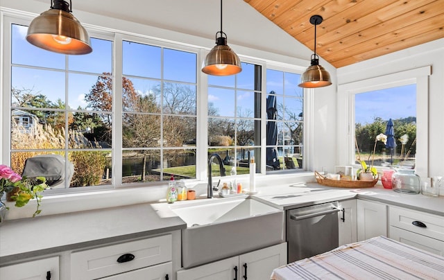 kitchen with white cabinets, vaulted ceiling, hanging light fixtures, and wood ceiling