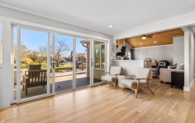 sitting room with wood ceiling, vaulted ceiling, ceiling fan, and light hardwood / wood-style floors