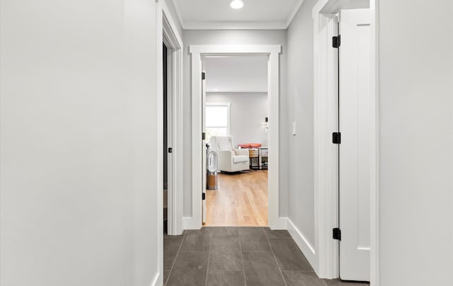 hallway with dark tile patterned floors