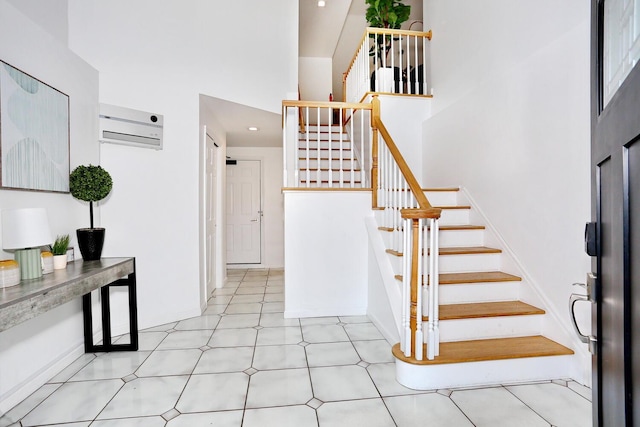 stairs with a wall mounted AC and a high ceiling