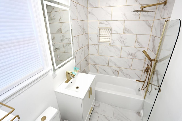 full bathroom with vanity, toilet, and tiled shower / bath