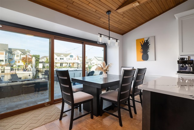 tiled dining area featuring wooden ceiling and lofted ceiling