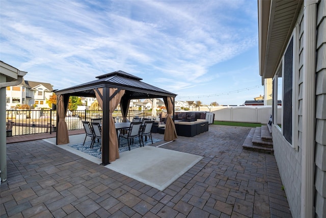 view of patio featuring a gazebo and an outdoor hangout area