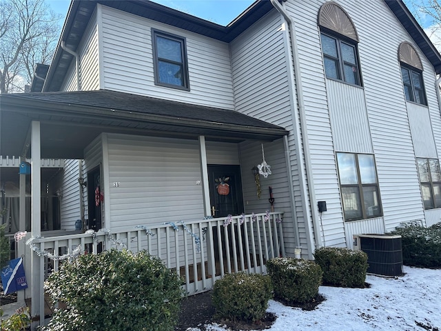 view of front facade with central AC unit and covered porch