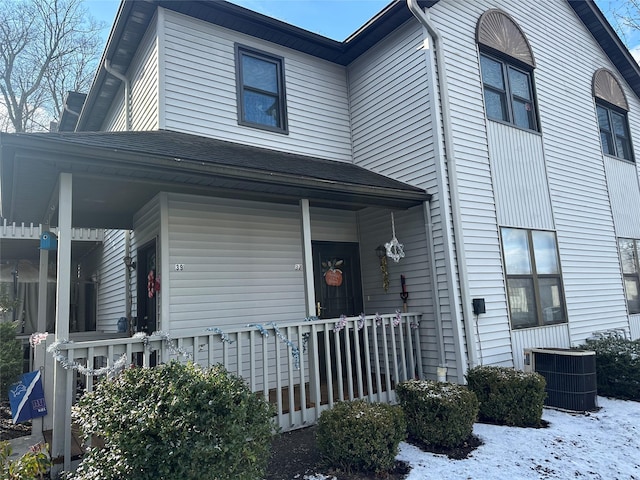 view of front of home with central AC unit and covered porch