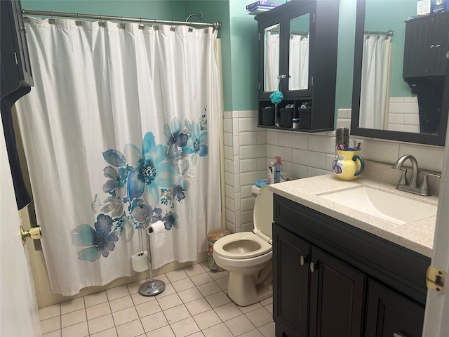 bathroom featuring toilet, tile walls, vanity, curtained shower, and tile patterned flooring