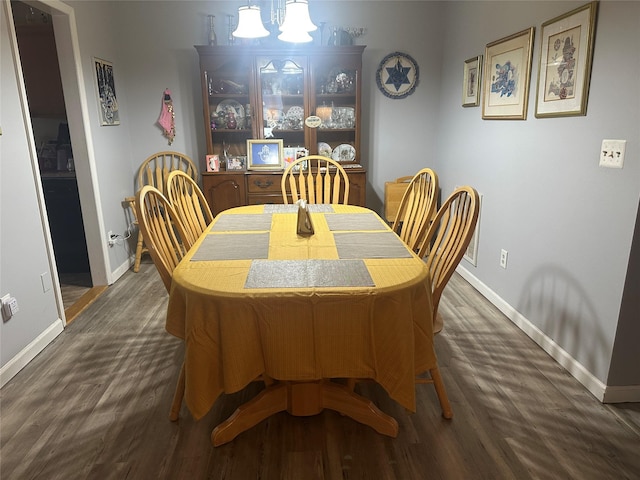 dining area featuring dark hardwood / wood-style flooring