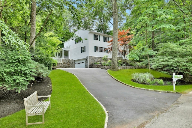 view of front of home with a garage and a front yard