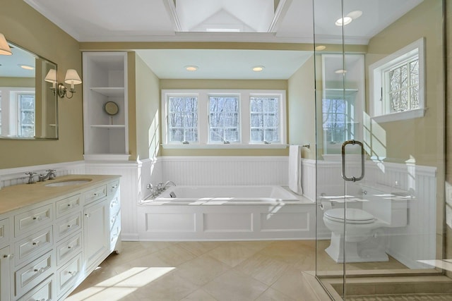 full bathroom with plenty of natural light, toilet, tile patterned flooring, and vanity