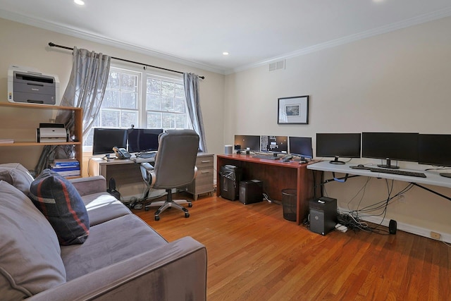 office area featuring wood-type flooring and ornamental molding