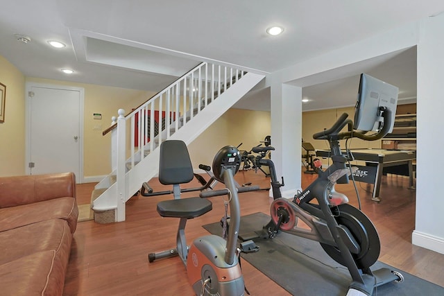 exercise room featuring hardwood / wood-style floors