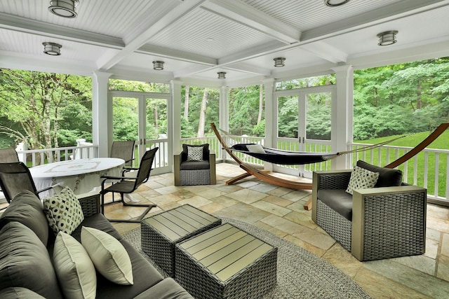 sunroom / solarium with coffered ceiling, beam ceiling, and french doors