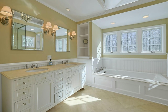 bathroom with a tub to relax in, vanity, tile patterned flooring, and built in features