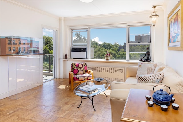 interior space with cooling unit, radiator, ornamental molding, and light parquet flooring