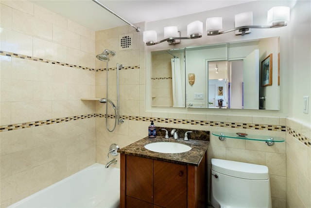 full bathroom with tile walls, vanity, tasteful backsplash, toilet, and shower / bath combo with shower curtain