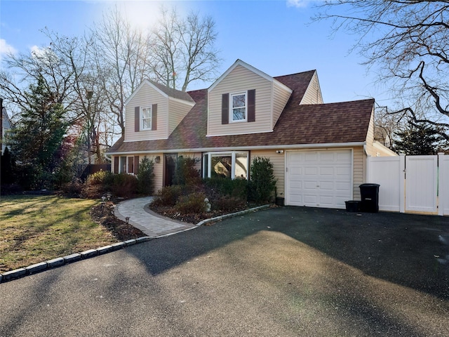 new england style home featuring a front lawn