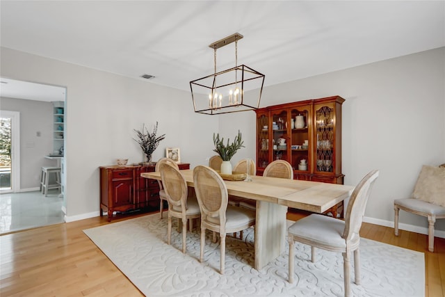 dining room featuring light hardwood / wood-style flooring